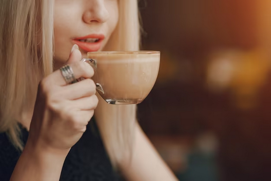 woman drinking a cup of coffee