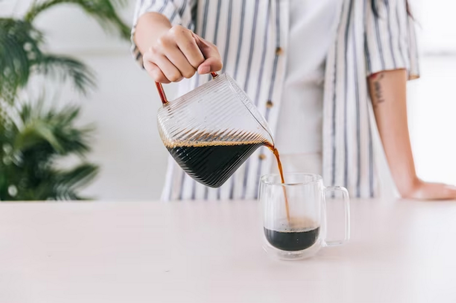 a person pouring coffee