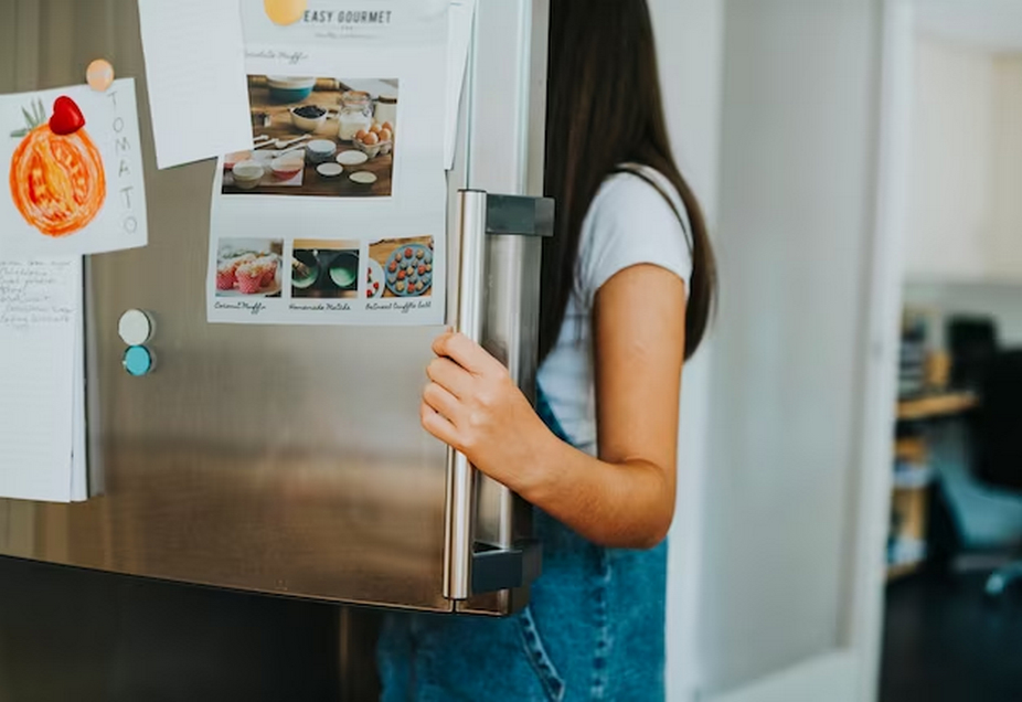 woman opening a refrigerator