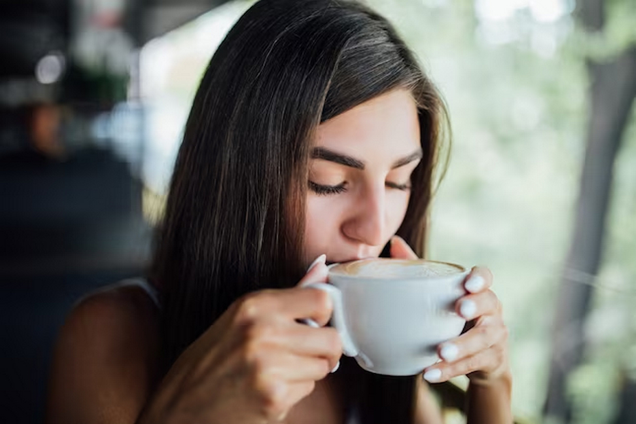Woman enjoying a sip of coffee
