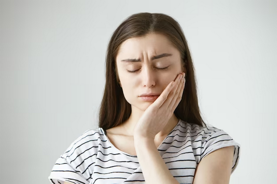 Woman touching her face